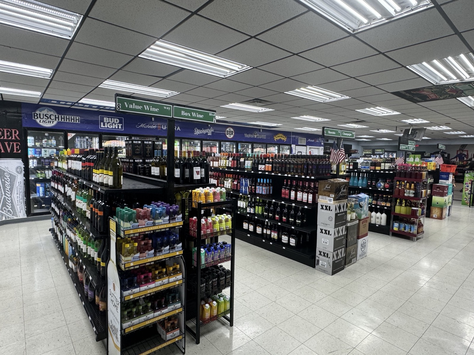 Wide view of the store's wine and beer aisles
